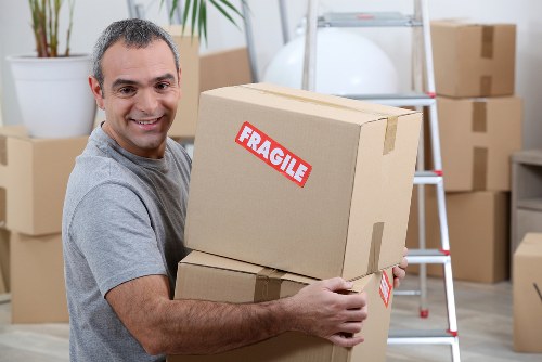 Removal van and moving team preparing a Kingston house move