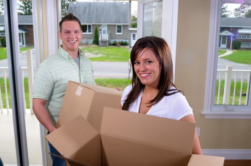 Furniture and boxes being loaded into a moving truck in Kingston