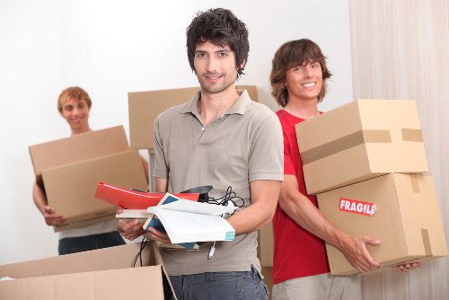 Local movers handling boxes in Kingston with care