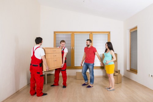 Man and van removals service in Kingston with moving van and boxes